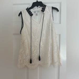 White lace with black trimmings this top is great for work or for fun